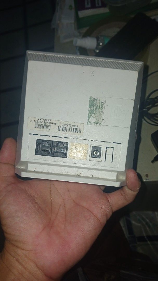 PLDT Home Powered by Smart LTE Router (Category: Networking) located in Manila. Submitted by marcas022798212 (Listing ID 1399172723, Image 3). Description: - PLDT Home router - Powered by Smart LTE - Includes router and power adapter - Features indicator lights and connectivity ports - Device information sticker at the back - In good working condition.