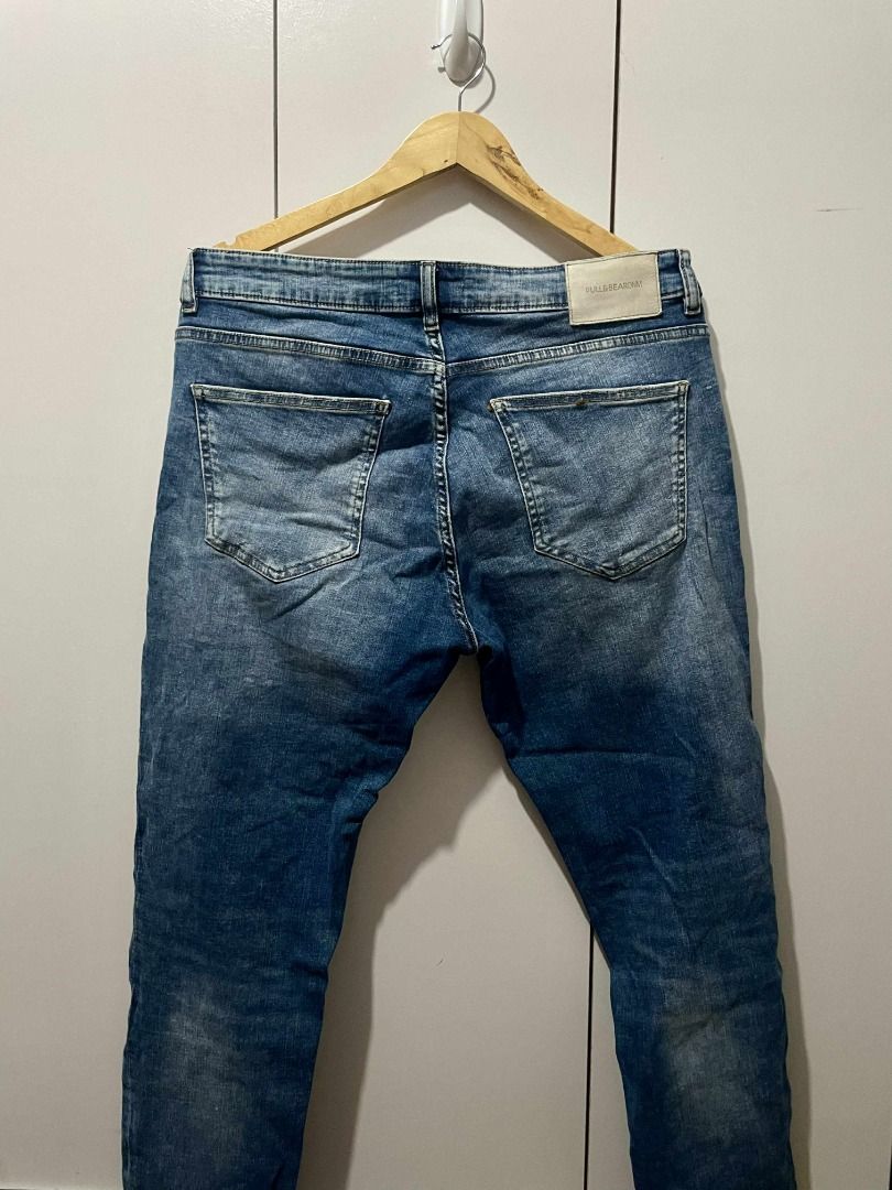Pull&Bear Blue Jeans (Category: Jeans) located in Pasig City. Submitted by reesekirsten_ (Listing ID 1399167728, Image 1). Description: - Pull&Bear blue jeans - Classic five-pocket design - Faded wash effect - Leather brand patch at the back - Currently hanging on a wooden hanger.