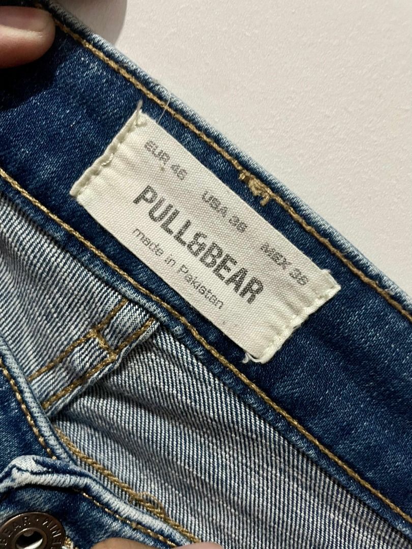 Pull&Bear Blue Jeans (Category: Jeans) located in Pasig City. Submitted by reesekirsten_ (Listing ID 1399167728, Image 3). Description: - Pull&Bear blue jeans - Classic five-pocket design - Faded wash effect - Leather brand patch at the back - Currently hanging on a wooden hanger.