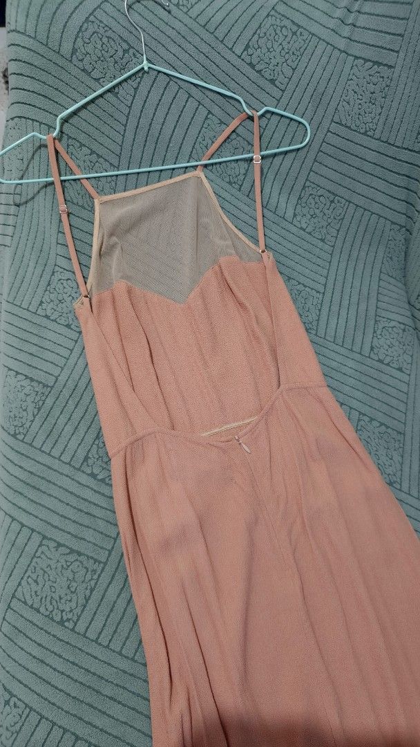 REFORMATION backless Peach-colored Spaghetti Strap Dress (Category: Dresses) located in Rizal. Submitted by declutterwithliz (Listing ID 1399094775, Image 2). Description: - Peach-colored dress - Spaghetti strap design - Mesh neckline - Fitted waist - Flowing skirt - Ready to wear.
