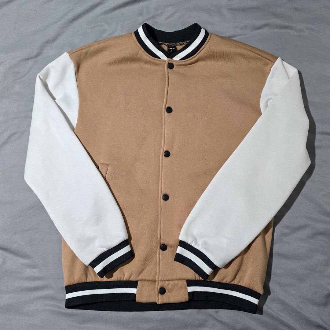 Shein Varsity Jacket - Small (Category: Coats, Jackets and Outerwear) located in Quezon City. Submitted by mfdoooom (Listing ID 1399128343, Image 1). Description: - Shein Varsity Jacket - Tan body with white sleeves - Black collar and cuffs with white stripes - Button-up front - Small size - Stylish and comfortable No issues Good as new Used once lang for a photoshoot Perfect for cold weather Loc: Quezon City Payment: Maya Mode of shipping: Flash