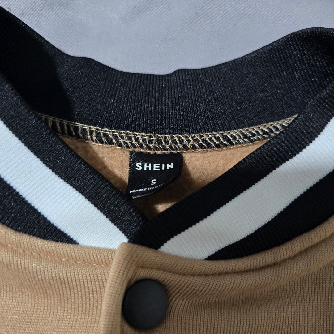 Shein Varsity Jacket - Small (Category: Coats, Jackets and Outerwear) located in Quezon City. Submitted by mfdoooom (Listing ID 1399128343, Image 2). Description: - Shein Varsity Jacket - Tan body with white sleeves - Black collar and cuffs with white stripes - Button-up front - Small size - Stylish and comfortable No issues Good as new Used once lang for a photoshoot Perfect for cold weather Loc: Quezon City Payment: Maya Mode of shipping: Flash