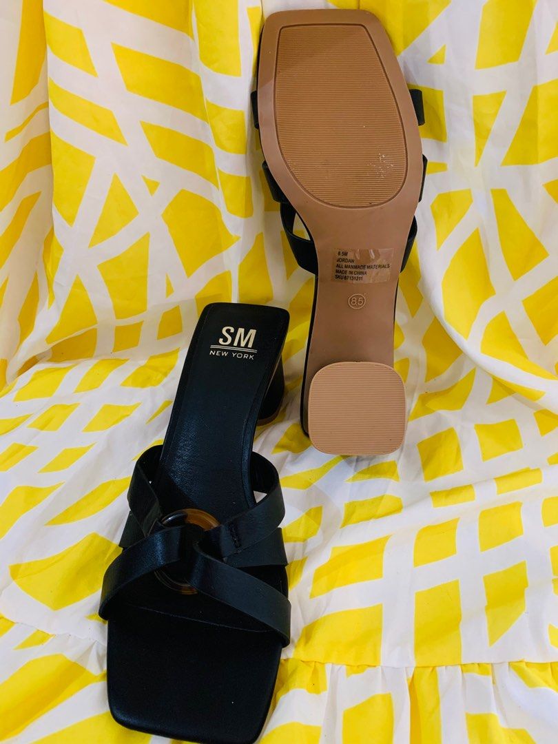 SM New York Black Sandals (Category: Flats & Sandals) located in Sarrat. Submitted by alohas_wagwagan (Listing ID 1399194455, Image 3). Description: - SM New York sandals - Black color - Square toe design - Strap across foot with decorative ring - Block heel - Light brown sole - Size 8.5M.