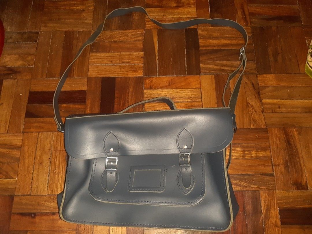 The Cambridge Satchel Company (Category: Luxury Bags & Wallets) located in Davao. Submitted by wonderwallnnipz_91 (Listing ID 1399183685, Image 2). Description: THE CAMBRIDGE SATCHEL COMPANY "BATCHEL" HANDMADE IN GREAT BRITAIN COLOR: NAVY BLUE GOOD CONDITION BUT MAY SMALL FLAWS (SEE PICTURE DETAILS) ACTUAL MEASUREMENTS: 15 INCHES x 9 INCHES x 4 INCHES (expandable) Market price : 17k plus P5000 plus SF Location: Davao City Contact no. 09312178260.