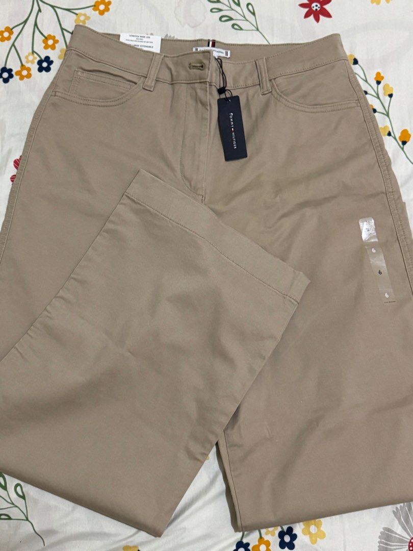 Tommy Hilfiger TH Flex Wide Leg Pants - Size 6 (Category: Other Bottoms) located in Orani. Submitted by xtine_rose (Listing ID 1399149669, Image 3). Description: - Tommy Hilfiger TH Flex wide leg pants - Neutral beige color - Size 6 - High-rise waist - Classic design with button closure and pockets - New with tags - Retail price: "$79.50".