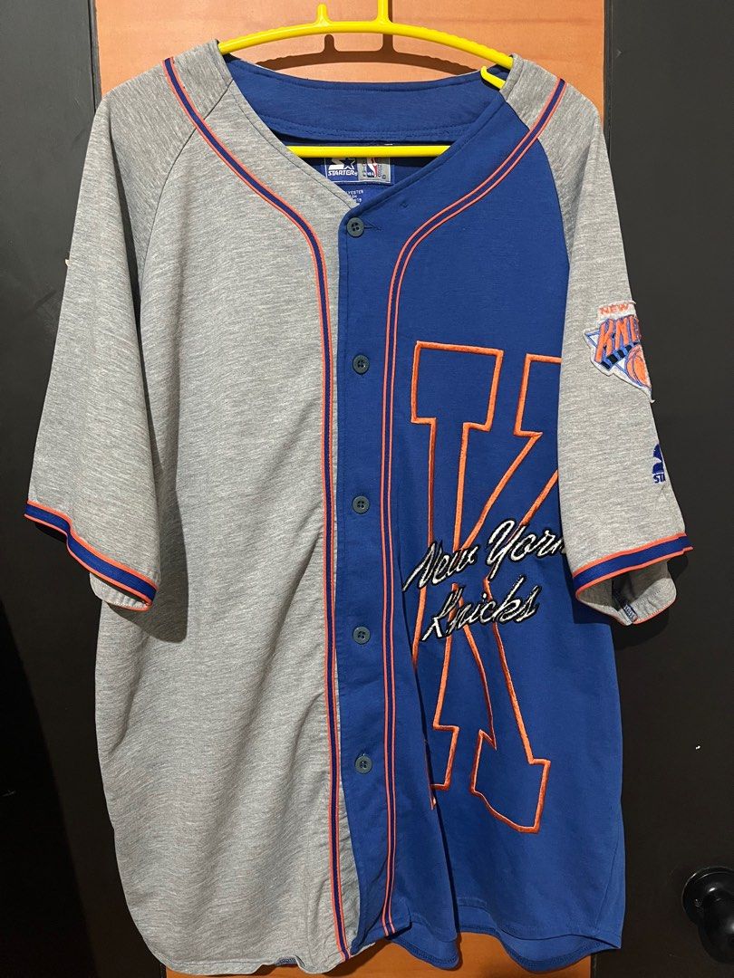 Vintage Starter New York Knicks Jersey (Category: Activewear) located in Dagupan City. Submitted by aysuck (Listing ID 1399233234, Image 1). Description: Vintage New York Knicks jersey by Starter Size: XL Good Condition Color Rate: 9/10 Issue: may tastas lang sa logo (photos for more details) - Color: Blue and grey - Material: 65% polyester, 35% cotton - Features Knicks logo - Button-up style with orange accents - Made in Korea - Perfect for coll