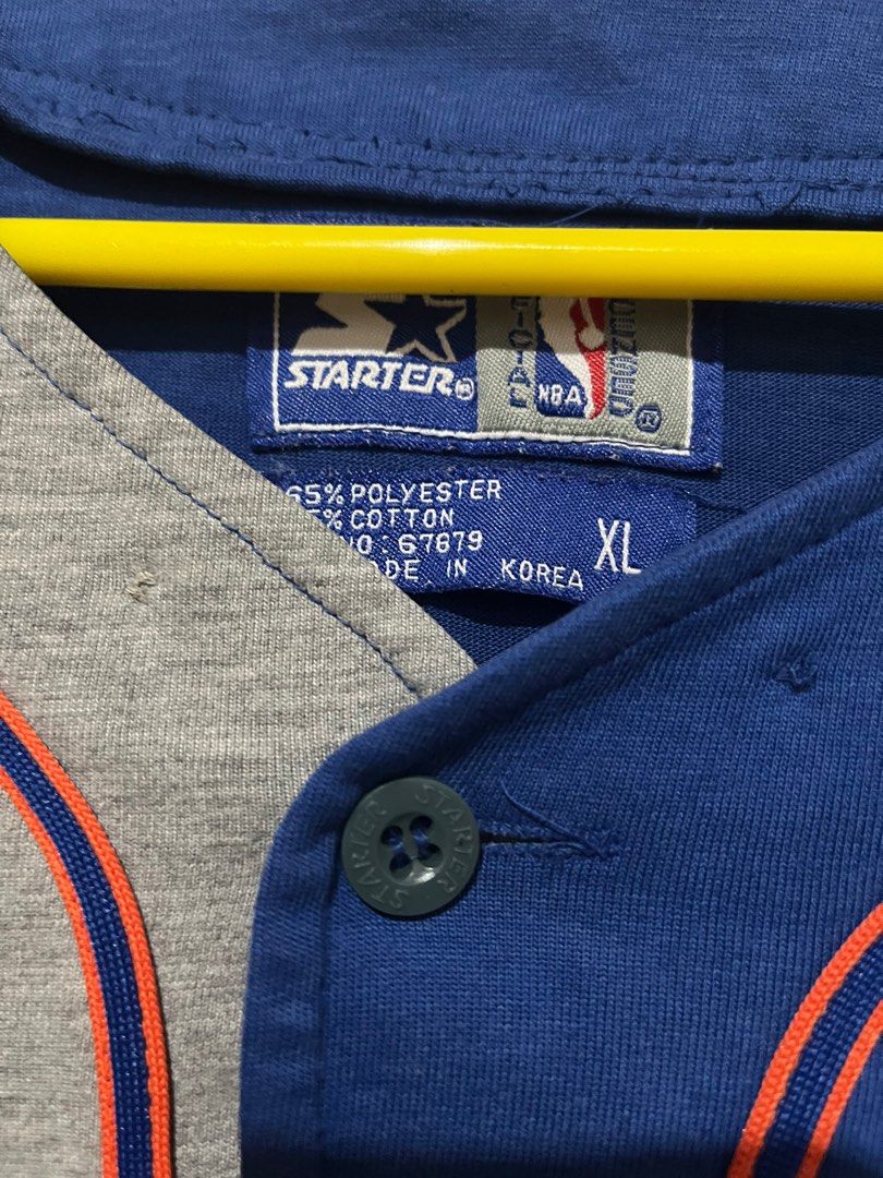 Vintage Starter New York Knicks Jersey (Category: Activewear) located in Dagupan City. Submitted by aysuck (Listing ID 1399233234, Image 2). Description: Vintage New York Knicks jersey by Starter Size: XL Good Condition Color Rate: 9/10 Issue: may tastas lang sa logo (photos for more details) - Color: Blue and grey - Material: 65% polyester, 35% cotton - Features Knicks logo - Button-up style with orange accents - Made in Korea - Perfect for coll