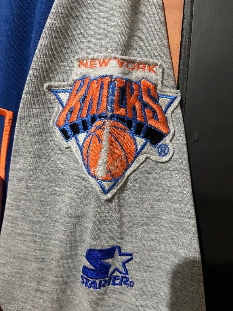 Vintage Starter New York Knicks Jersey (Category: Activewear) located in Dagupan City. Submitted by aysuck (Listing ID 1399233234, Image 3). Description: Vintage New York Knicks jersey by Starter Size: XL Good Condition Color Rate: 9/10 Issue: may tastas lang sa logo (photos for more details) - Color: Blue and grey - Material: 65% polyester, 35% cotton - Features Knicks logo - Button-up style with orange accents - Made in Korea - Perfect for coll