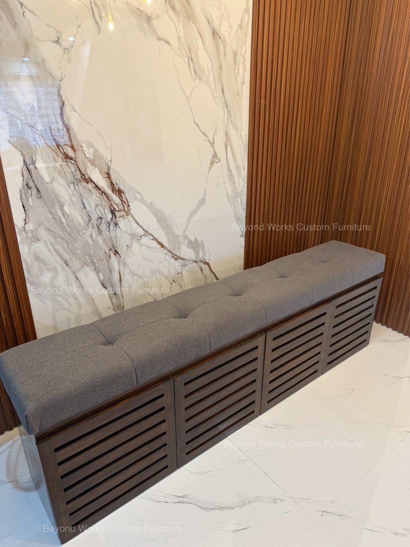 Wooden Shoe Bench with Storage (Category: Shelves, Cabinets & Racks) located in Manila. Submitted by jennyromulo (Listing ID 1399179662, Image 2). Description: - Wooden shoe bench with storage. - Padded, button-tufted gray seat. - Dark wood finish. - Slatted door fronts. - Ideal for entryways or bedrooms. - Provides seating and shoe organization..