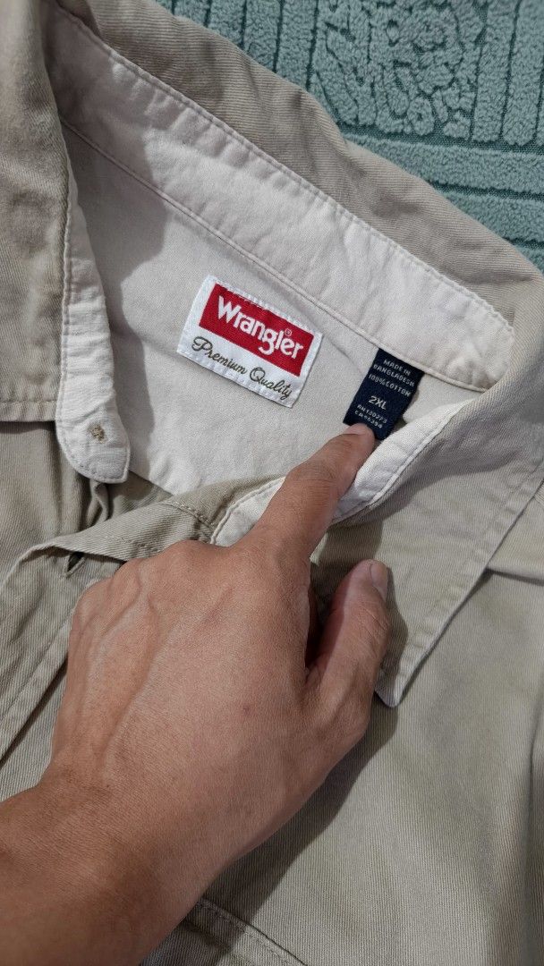 Wrangler Long Sleeve Shirt (Category: Tshirts & Polo Shirts ) located in Rizal. Submitted by declutterwithliz (Listing ID 1399096004, Image 2). Description: - Wrangler long sleeve shirt - Size: 2XL - Button-down style - Features a chest pocket - Neutral color - versatile for any outfit - Classic collar - Buttoned cuffs - Made of durable fabric.