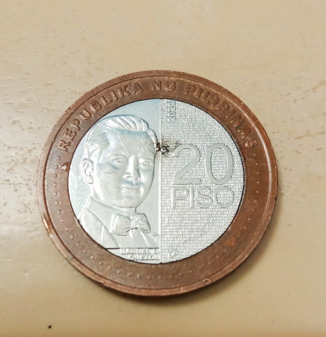 20 Peso 2020 NGC Philippine Coin with Error (Category: Currency) located in Candon. Submitted by sniper_25 (Listing ID 1395930181, Image 2). Description: - 20 Peso NGC coin from the Philippines - Year: 2020 - Features a minting error (extra metal) - Obverse: Manuel Quezon - Reverse: Sampaguita flower Denomination: It is the highest denomination coin of the Philippine peso. Issuance: Launched in December 2019, it is part of the Bangko Sentral ng P