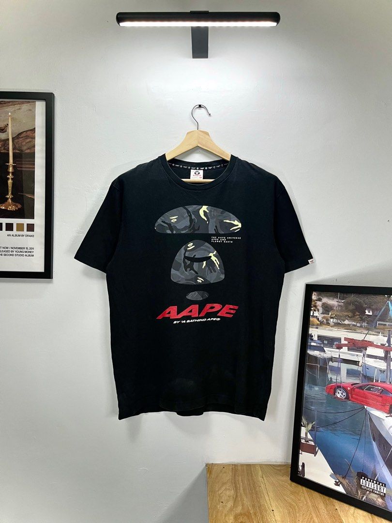 Aape by A Bathing Ape Black T-shirt (Category: Tshirts & Polo Shirts ) located in Cavite. Submitted by robievillon (Listing ID 1396093990, Image 1). Description: 23x29” XL on tag - Black Aape by A Bathing Ape T-shirt - Size: XL - Features a large Aape graphic on the front - Aape logo printed on the neck - Made of 100% cotton - Crew neck and short sleeves.