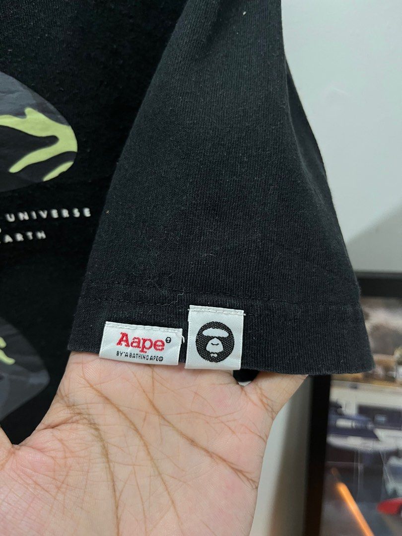 Aape by A Bathing Ape Black T-shirt (Category: Tshirts & Polo Shirts ) located in Cavite. Submitted by robievillon (Listing ID 1396093990, Image 3). Description: 23x29” XL on tag - Black Aape by A Bathing Ape T-shirt - Size: XL - Features a large Aape graphic on the front - Aape logo printed on the neck - Made of 100% cotton - Crew neck and short sleeves.