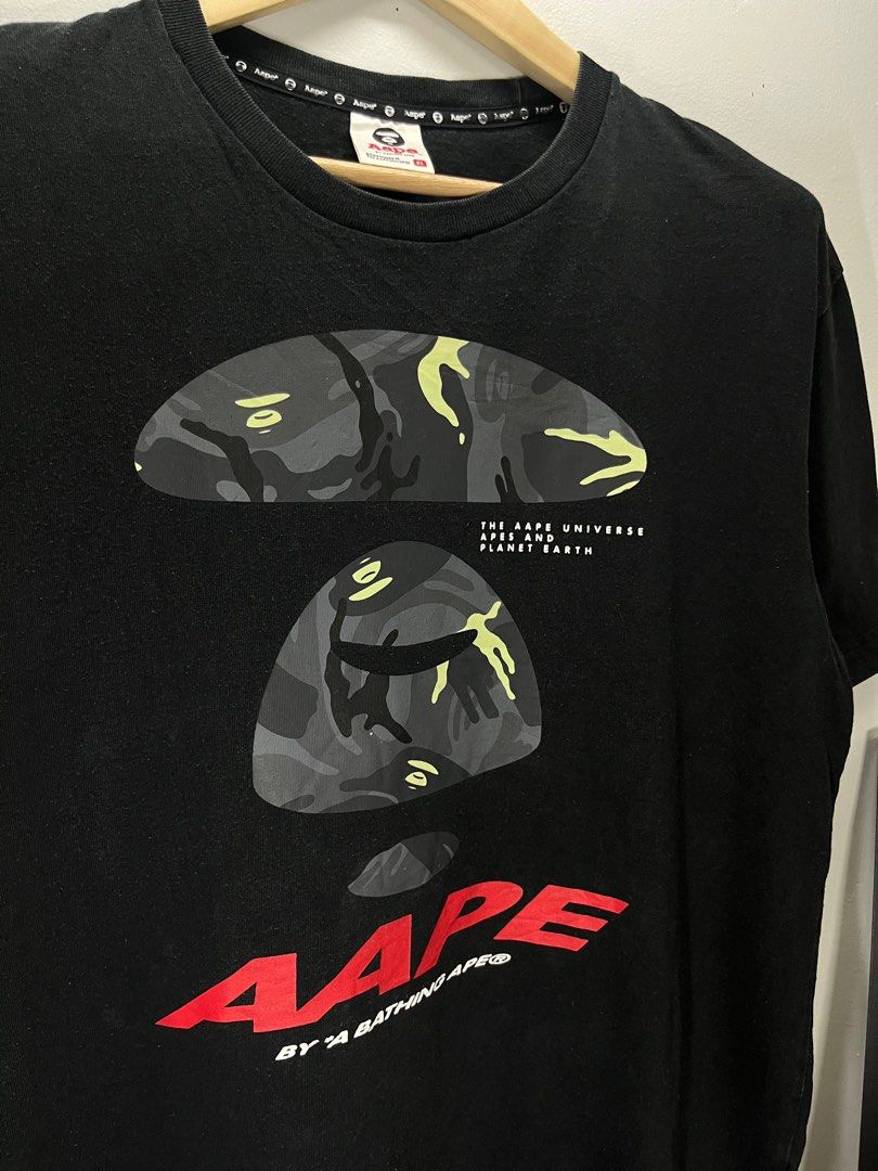 Aape by A Bathing Ape Black T-shirt (Category: Tshirts & Polo Shirts ) located in Cavite. Submitted by robievillon (Listing ID 1396093990, Image 2). Description: 23x29” XL on tag - Black Aape by A Bathing Ape T-shirt - Size: XL - Features a large Aape graphic on the front - Aape logo printed on the neck - Made of 100% cotton - Crew neck and short sleeves.