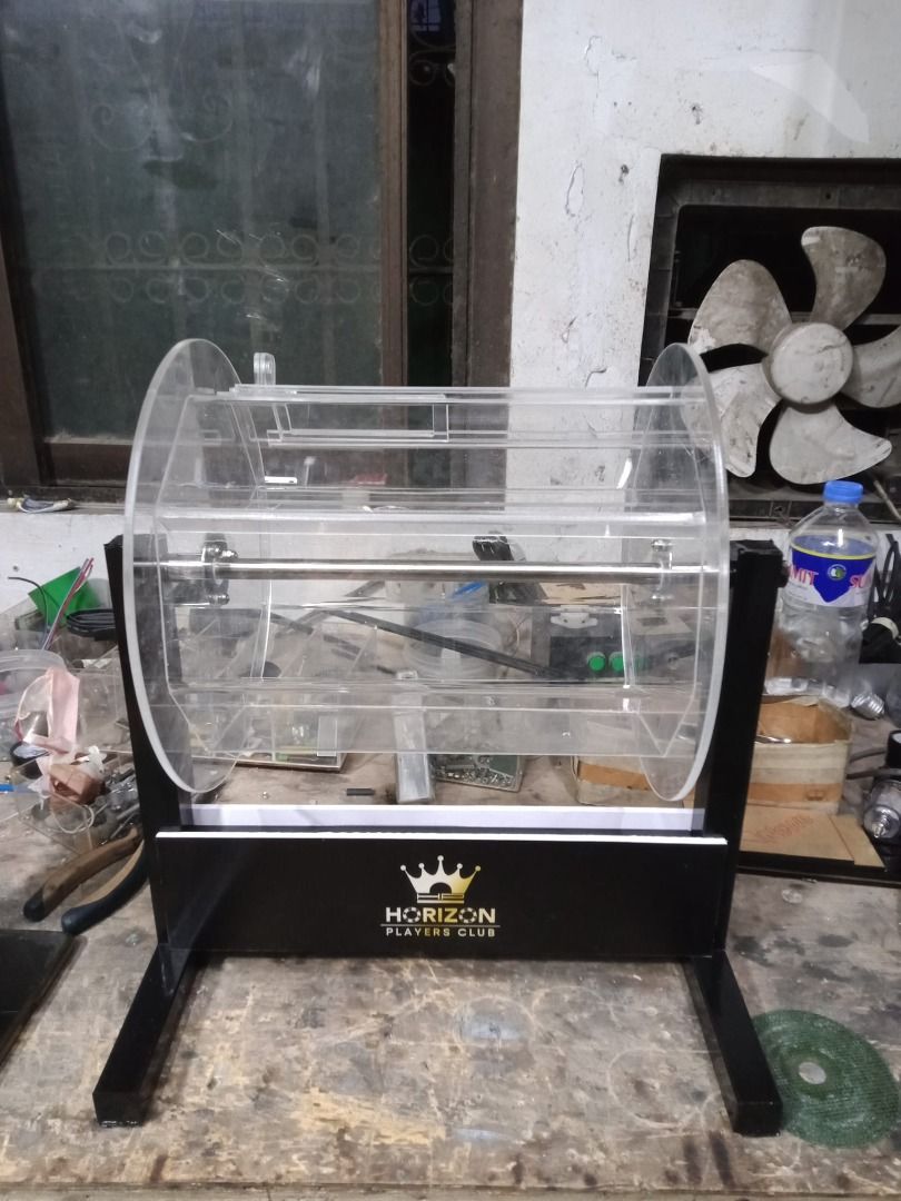 Acrylic Raffle Drum with Stand (Category: Storage Boxes & Baskets) located in Caloocan City. Submitted by mimicg1220 (Listing ID 1395938987, Image 3). Description: Customized Acrylic roleta - Durable acrylic raffle drum - Sturdy metal stand - Clear, transparent design - Easy visibility of contents - Suitable for events and promotions - Designed for easy loading and unloading - Provides stability and a professional look - Perfect for draws, contes