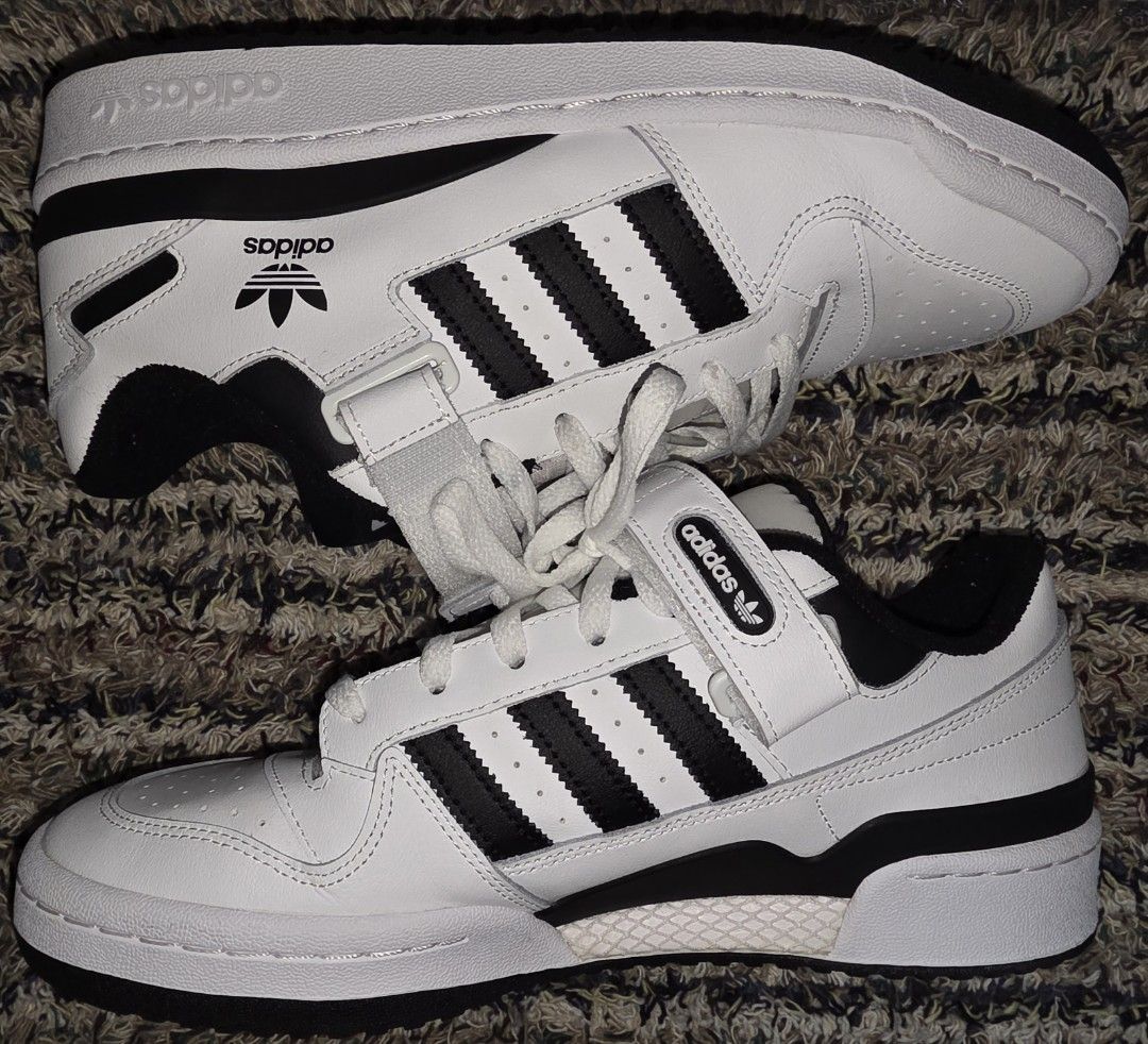 Adidas Forum Low White Black (Category: Sneakers) located in Makati City. Submitted by mjfil (Listing ID 1395969318, Image 1). Description: - Adidas Forum Low sneakers - White with black accents - Features the iconic three stripes - Velcro strap for secure fit - Adidas logo on tongue and side - White sole with black detail.