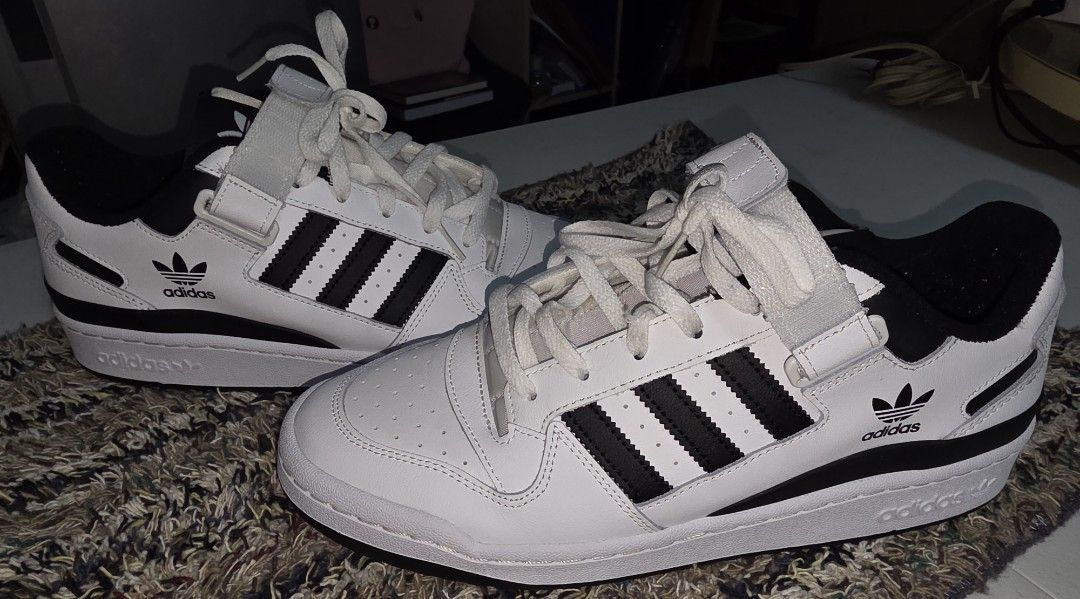 Adidas Forum Low White Black (Category: Sneakers) located in Makati City. Submitted by mjfil (Listing ID 1395969318, Image 2). Description: - Adidas Forum Low sneakers - White with black accents - Features the iconic three stripes - Velcro strap for secure fit - Adidas logo on tongue and side - White sole with black detail.