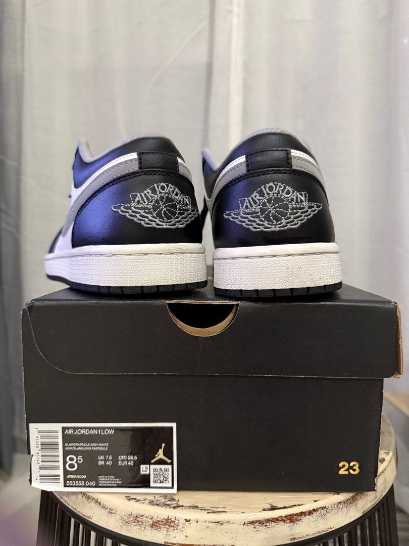 Air Jordan 1 Low - black white grey (Category: Sneakers) located in Quezon City. Submitted by alloriginalthrift (Listing ID 1396080762, Image 3). Description: - Air Jordan 1 Low sneakers - Color: Black, white, and grey - Features the iconic Air Jordan logo - Size: US 8.5 UK 7.5 EU 42 - Comes with the original box.