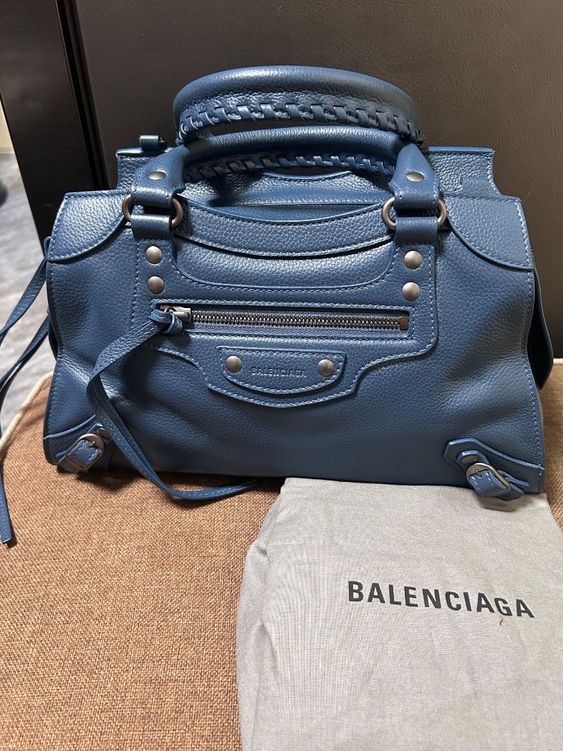 Balenciaga City Bag (Category: Luxury Bags & Wallets) located in Caloocan City. Submitted by piamariemo11606 (Listing ID 1396088900, Image 1). Description: - Authentic Balenciaga City Bag - Stunning blue color - Top handle design - Convenient front zipper pocket - Secure zipper closure - Includes original dust bag and tags - Crafted from textured leather - Balenciaga logo on zipper pull.