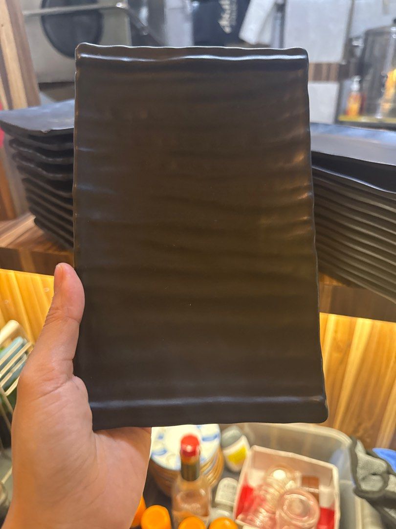 Black Rectangular Plates (Category: Dinnerware & Cutlery) located in Singapore. Submitted by purefish.65a95b (Listing ID 1396008648, Image 3). Description: -black rectangular plates - Suitable for appetizers, sushi, and small dishes - Made of durable material - Stackable for easy storage - Great for restaurants and home use.