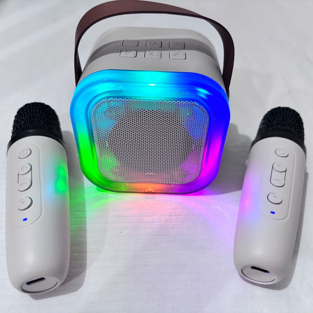 Bluetooth Speaker with 2 Microphones K12 Mini Karaoke (Category: Soundbars, Speakers & Amplifiers) located in Manila. Submitted by 02hamako (Listing ID 1396031557, Image 2). Description: -Bluetooth Speaker with 2 Microphones K12 Mini Karaoke - Speaker features: - Colorful LED lights - Portable with a handle - Multiple input options: AUX, USB, TF card - Microphones with control buttons - Comes with a charging cable Beige color. Never used. All are