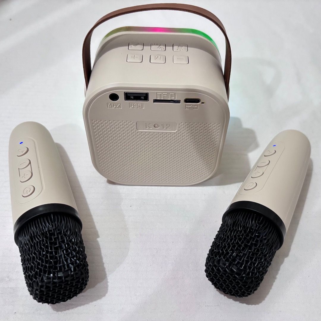Bluetooth Speaker with 2 Microphones K12 Mini Karaoke (Category: Soundbars, Speakers & Amplifiers) located in Manila. Submitted by 02hamako (Listing ID 1396031557, Image 3). Description: -Bluetooth Speaker with 2 Microphones K12 Mini Karaoke - Speaker features: - Colorful LED lights - Portable with a handle - Multiple input options: AUX, USB, TF card - Microphones with control buttons - Comes with a charging cable Beige color. Never used. All are