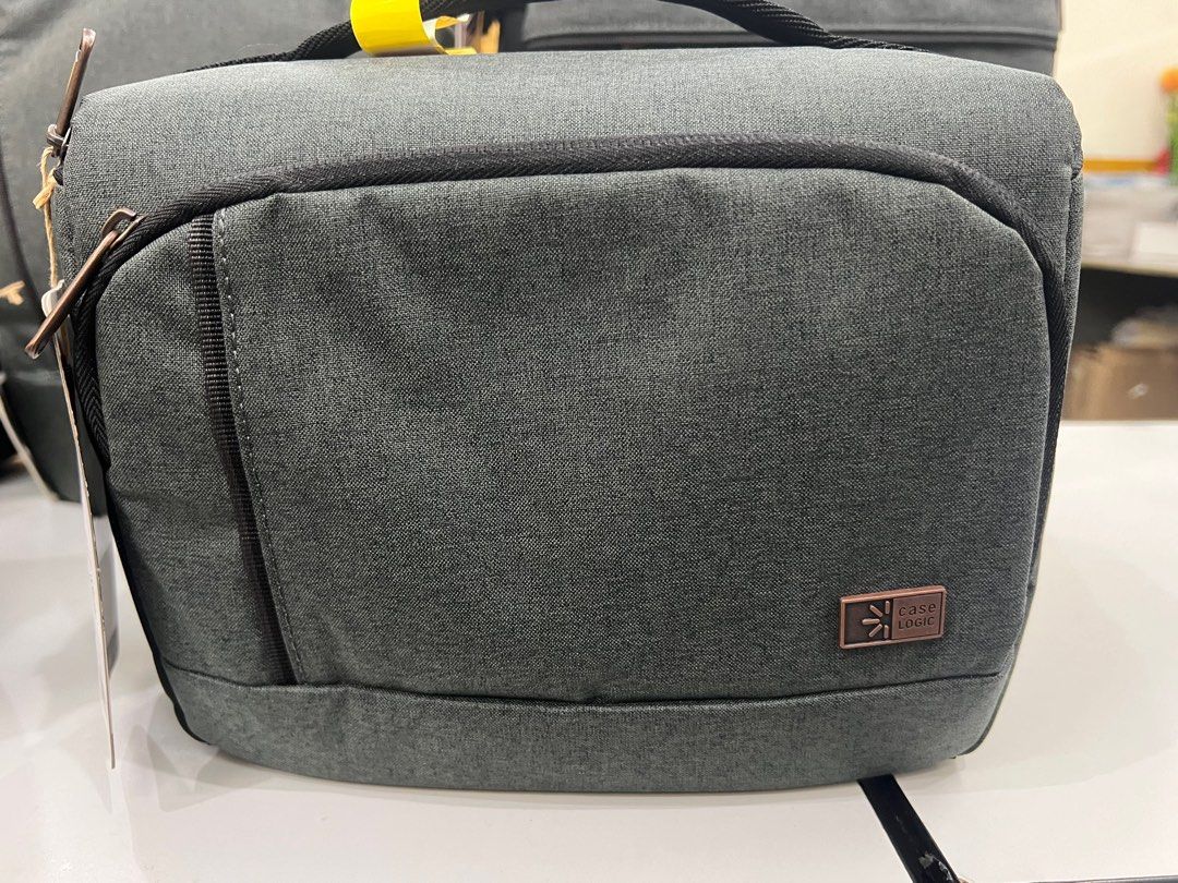 Case Logic Backpack and Camera Bag Set small medium large (Category: Camera Bags & Carriers) located in Pasig City. Submitted by etcyshop (Listing ID 1395967062, Image 2). Description: - New Case Logic backpack and camera bag set. - Gray fabric exterior. - Includes various sizes of backpacks. - Camera bags also available. - Some bags feature a top handle and front pocket. - All items are new with tags attached..