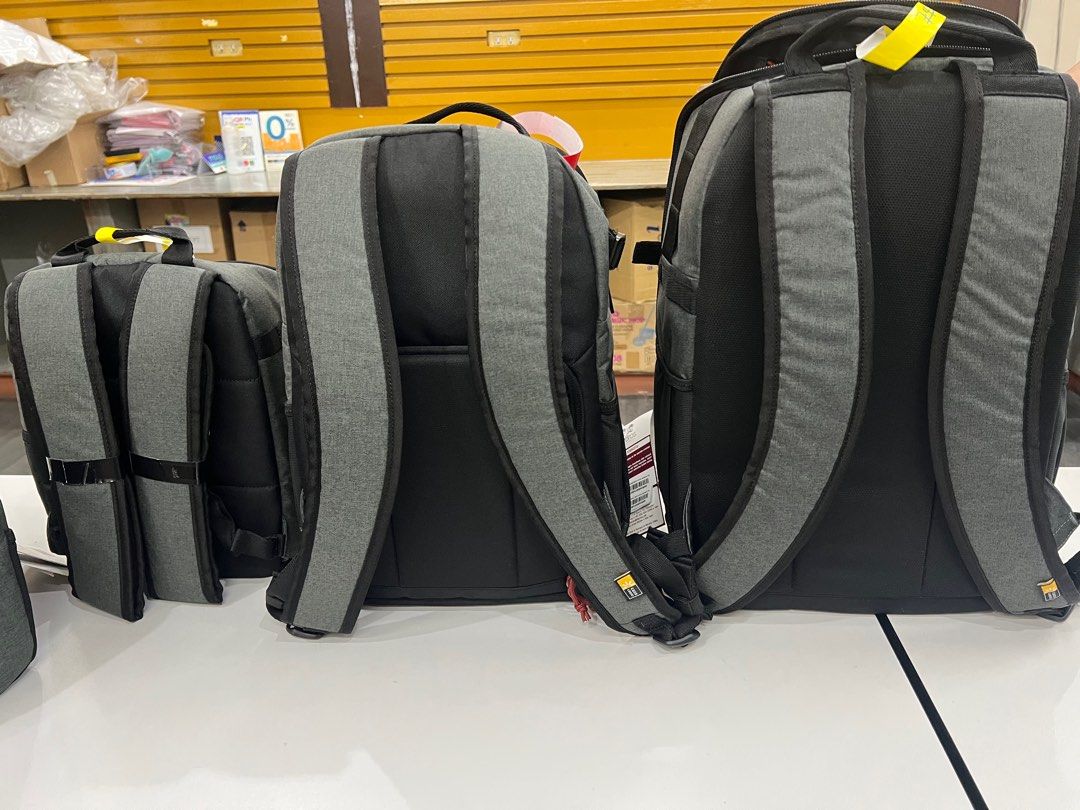 Case Logic Backpack and Camera Bag Set small medium large (Category: Camera Bags & Carriers) located in Pasig City. Submitted by etcyshop (Listing ID 1395967062, Image 3). Description: - New Case Logic backpack and camera bag set. - Gray fabric exterior. - Includes various sizes of backpacks. - Camera bags also available. - Some bags feature a top handle and front pocket. - All items are new with tags attached..