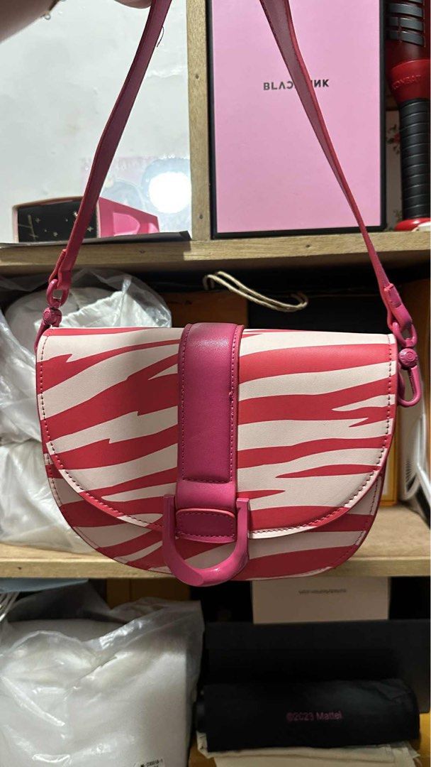 Charles & Keith x Chau Bui Zebra Print Bag (Category: Shoulder Bags) located in Binan City. Submitted by _elleinad (Listing ID 1396095880, Image 2). Description: - Charles & Keith x Chau Bui Gabine saddle bag - Excellent condition - Stylish design - Durable material - MPO Used once for an event Still negotiable .