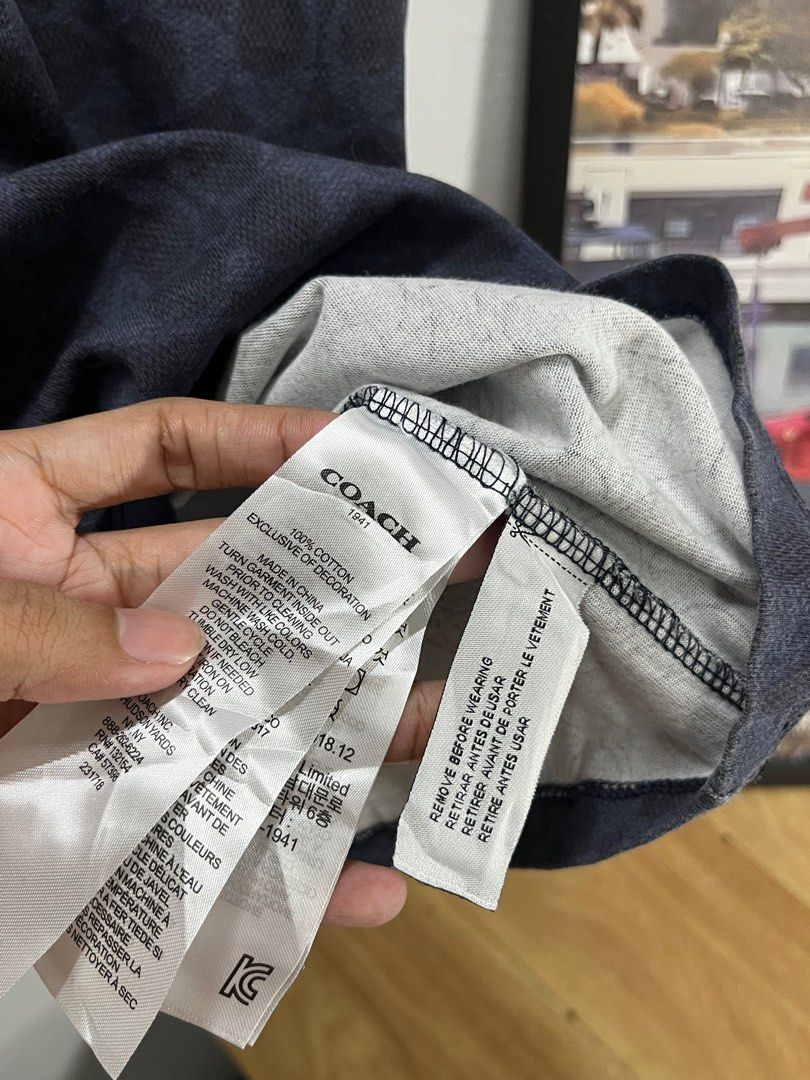 Coach Dream On T-shirt (Category: Tshirts & Polo Shirts ) located in Cavite. Submitted by robievillon (Listing ID 1396093643, Image 2). Description: 21x26” M on tag - Coach T-shirt with "Dream On" print - Navy blue color with repeating pattern - Size: Medium - Includes original tags.