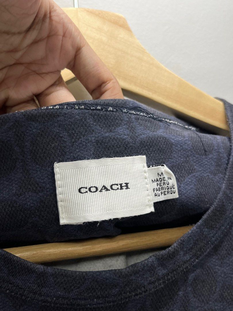 Coach Dream On T-shirt (Category: Tshirts & Polo Shirts ) located in Cavite. Submitted by robievillon (Listing ID 1396093643, Image 3). Description: 21x26” M on tag - Coach T-shirt with "Dream On" print - Navy blue color with repeating pattern - Size: Medium - Includes original tags.