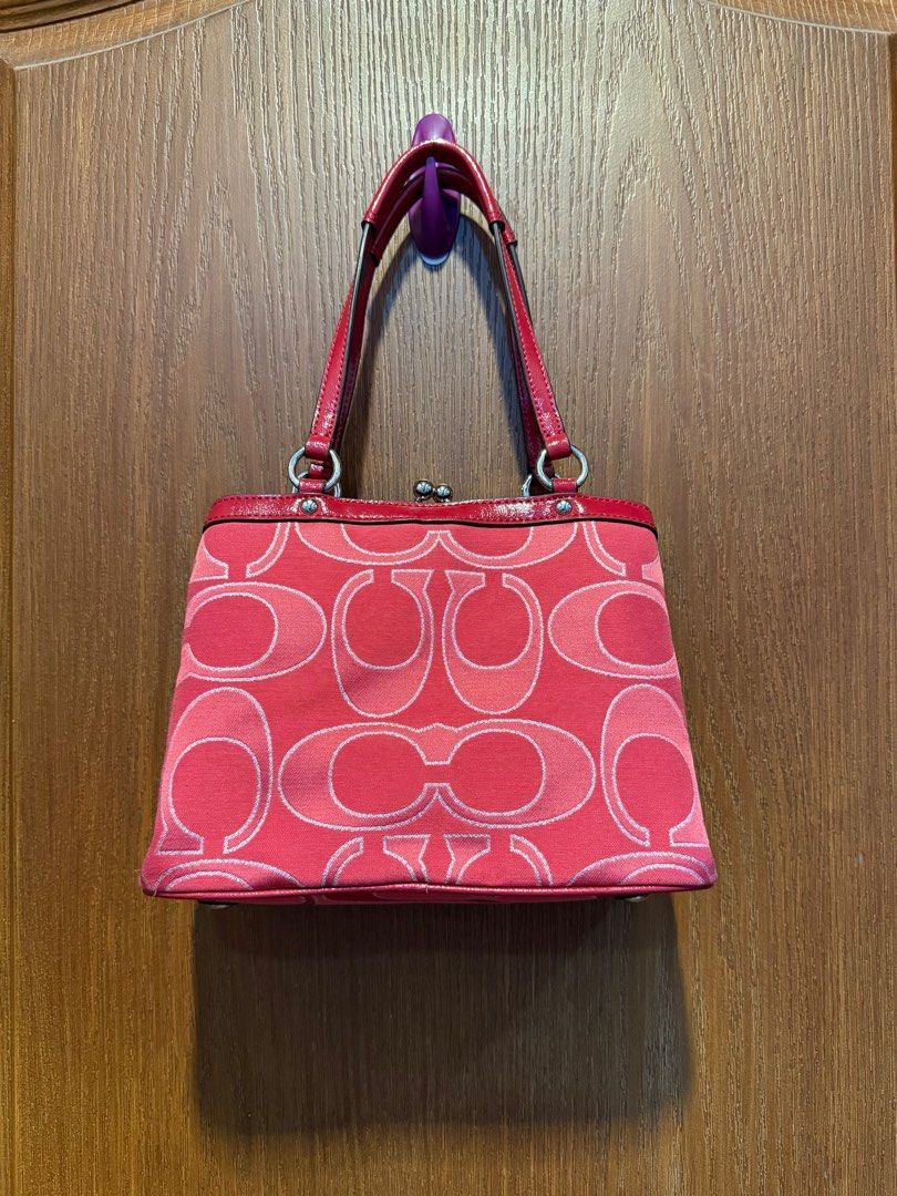 COACH Red Signature Canvas Bag (Category: Luxury Bags & Wallets) located in Quezon City. Submitted by michaelacd (Listing ID 1395988541, Image 2). Description: COACH Red Signature Canvas Bag - can be worn on the shoulder - used once lang sa house. still in great condition - it actually comes with a strap but since matagal na store it became a bit sticky so may tuklap in some parts of the sides. (Dm me for pics) if the condition of the strap is ok
