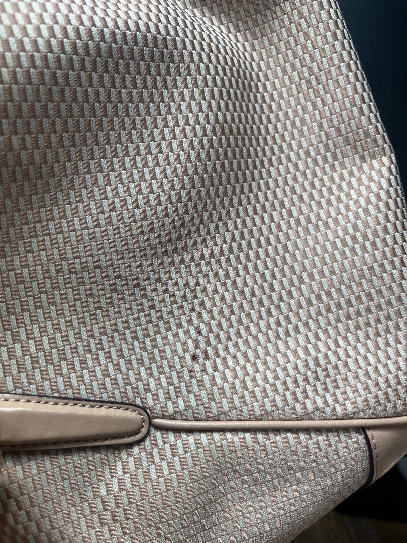 Coach Woven Handbag with Shoulder Strap (Category: Luxury Bags & Wallets) located in Manila. Submitted by nannro (Listing ID 1395969275, Image 2). Description: - Coach handbag with woven design - Top zipper closure - Detachable shoulder strap - Includes Coach hang tag - Light brown color - Interior with multiple compartments and Coach label - Minor marks on the exterior.