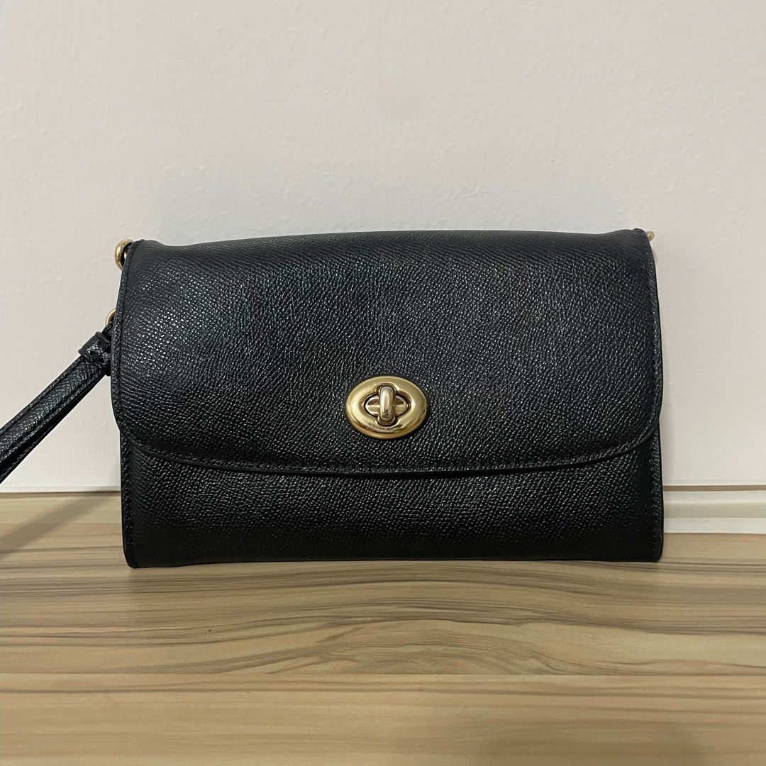 Coach Wristlet (Category: Clutches) located in Marikina City. Submitted by pial21 (Listing ID 1396049116, Image 1). Description: Coach wristlet This is originally a Coach Wallet on Chain but I lost the chain :( Good condition Bought from Coach Chicago Outlet rfs: not using anymore.