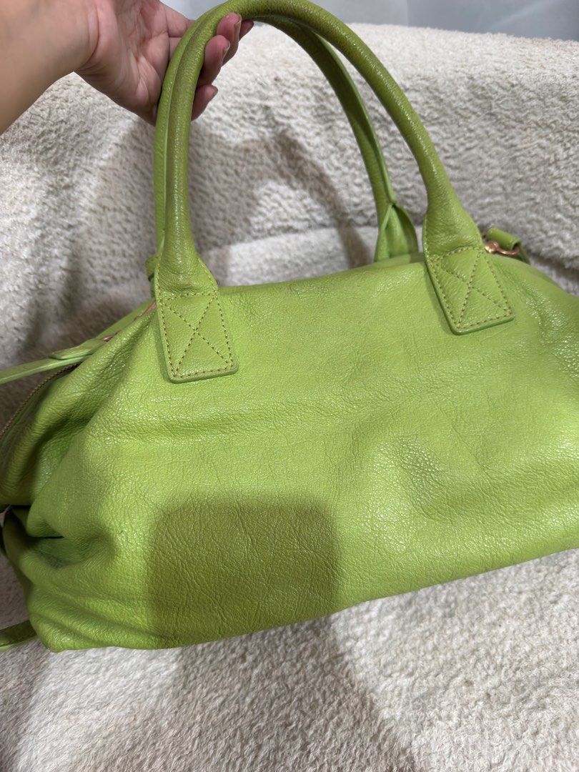 Couronne Green Leather two way bag (Category: Luxury Bags & Wallets) located in Consolacion. Submitted by mrshoarderrr (Listing ID 1396086590, Image 2). Description: - Couronne green leather handbag - Top handle and detachable shoulder strap - Secure zip closure - Elegant gold-tone hardware - Includes Couronne logo tag and front metal plate - Structured shape with textured leather exterior - Light beige interior lining.
