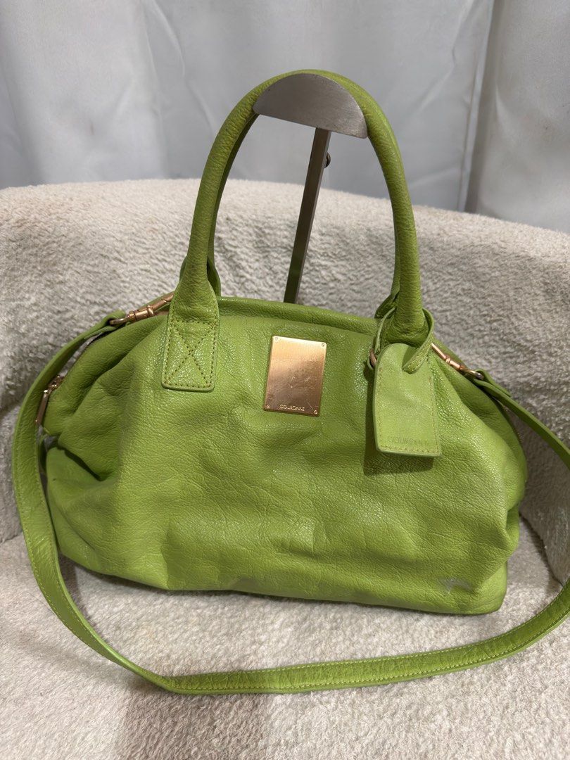 Couronne Green Leather two way bag (Category: Luxury Bags & Wallets) located in Consolacion. Submitted by mrshoarderrr (Listing ID 1396086590, Image 1). Description: - Couronne green leather handbag - Top handle and detachable shoulder strap - Secure zip closure - Elegant gold-tone hardware - Includes Couronne logo tag and front metal plate - Structured shape with textured leather exterior - Light beige interior lining.