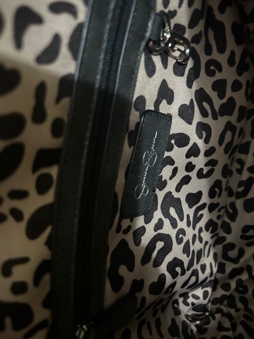 Jessica Simpson Black Tote Bag (Category: Tote Bags) located in Rizal. Submitted by declutter101s (Listing ID 1396051857, Image 2). Description: - Jessica Simpson tote bag - grayish - Zip closure - Leopard print interior - Silver-tone studs and hardware - Textured exterior - Includes brand tag.
