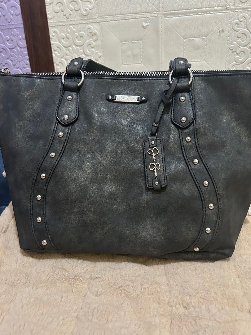 Jessica Simpson Black Tote Bag (Category: Tote Bags) located in Rizal. Submitted by declutter101s (Listing ID 1396051857, Image 3). Description: - Jessica Simpson tote bag - grayish - Zip closure - Leopard print interior - Silver-tone studs and hardware - Textured exterior - Includes brand tag.