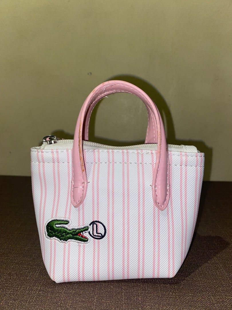 Dupe Lacoste Mini Handbag (Category: Shoulder Bags) located in Bulacan. Submitted by nyxara12 (Listing ID 1396069910, Image 1). Description: FOR SALE: Lacoste mini handbag — Pink and white striped design — With detachable strap — Zipper works well MOP: GCash / BPI MOD: Lalamove / J&T (the buyer will shoulder the shipping fee) — no refund/cancellation of order Item location: Bulacan.
