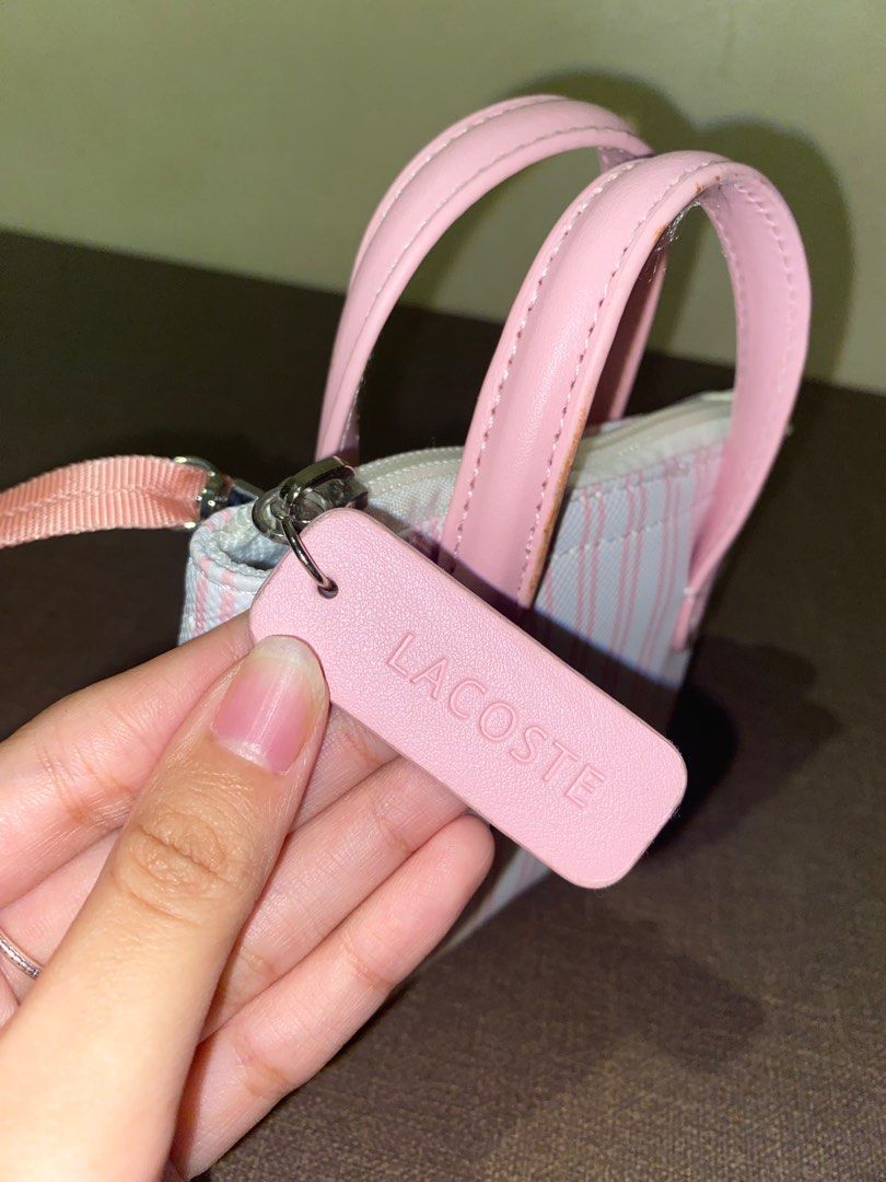 Dupe Lacoste Mini Handbag (Category: Shoulder Bags) located in Bulacan. Submitted by nyxara12 (Listing ID 1396069910, Image 3). Description: FOR SALE: Lacoste mini handbag — Pink and white striped design — With detachable strap — Zipper works well MOP: GCash / BPI MOD: Lalamove / J&T (the buyer will shoulder the shipping fee) — no refund/cancellation of order Item location: Bulacan.