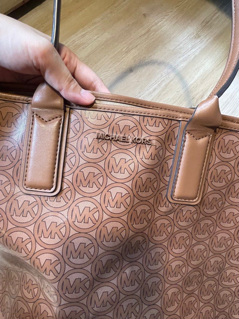 Michael Kors - Monogram Tote Bag in brown (Category: Tote Bags) located in Batangas. Submitted by hellocedi (Listing ID 1395981458, Image 3). Description: - Still a really pretty bag. - Goyard vibes - the design is still in store sa Acienda outlets for 16k above (dpende sa size) - The flaws are not very noticeable. - Naiwan sa car kaya nag open yung sa may handle. But since stitched yung handle hindi naman sya masisira :) Haven’t really used this
