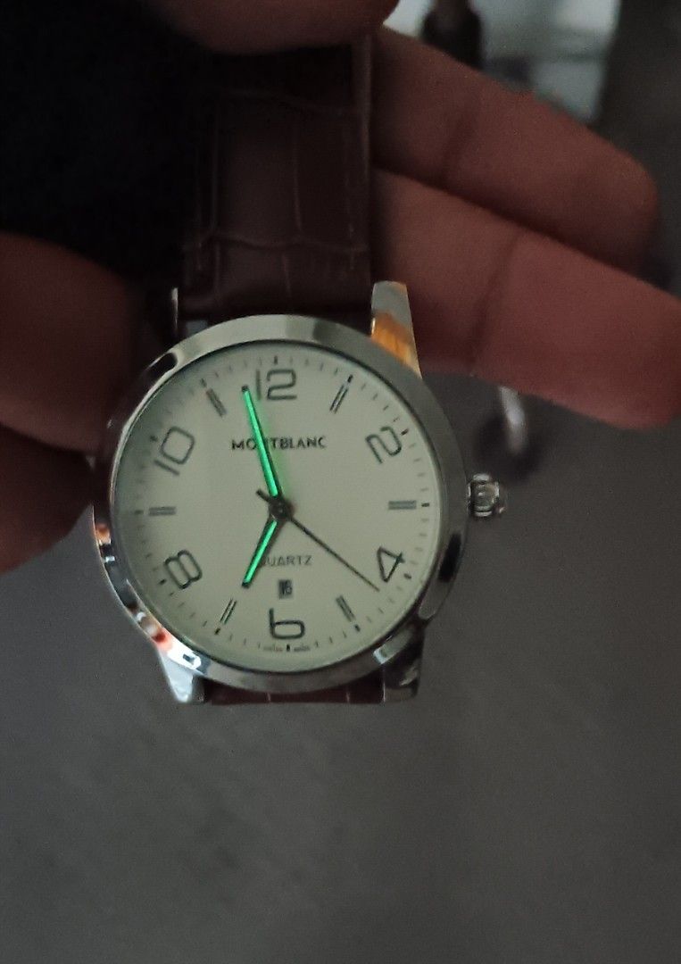 Montblanc Watch (Category: Luxury Watches) located in Quezon City. Submitted by bong_austria24 (Listing ID 1396053928, Image 3). Description: - Montblanc watch - Silver case - Cream-colored dial - Luminous hands and markers - Date display at 6 o'clock available in black and brown leather strap (hindi po isang watch 2 strap kasama magka iba po yan) price - 1850.