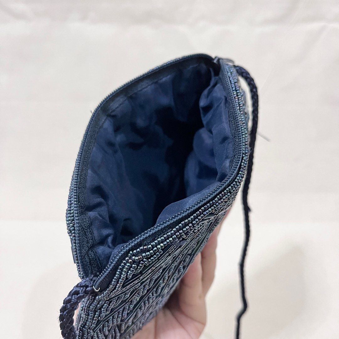 Shell Design Navy Blue Beaded Shell Clutch / Crossbody Bag (Category: Clutches) located in Antipolo. Submitted by aristokai (Listing ID 1396076984, Image 2). Description: ✅ Like new condition and no flaws ✅ Very nice beaded small bag, lined interior, and unique shell design ✅ Can fit small items (Di po kasya ang cellphone! Maybe yung foldable ZFlip can fit) ☺️ Please feel free to make an offer! Payment options: ❤️ Cash on Delivery thru LBC door t