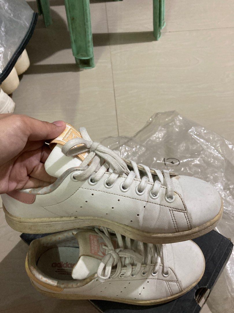 Original Adidas Stan Smith White Sneakers (Category: Sneakers) located in Binan City. Submitted by _elleinad (Listing ID 1395928706, Image 3). Description: - Adidas Stan Smith sneakers - White with pink and yellow accents - Stan Smith logo on heel - Size: US 5.5, UK 5, FR 38, JP 240, CHN 235 - Made in India No box. Needs cleaning.