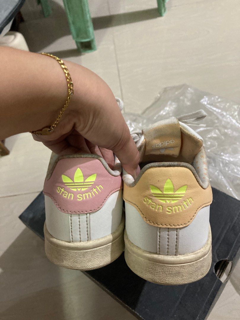Original Adidas Stan Smith White Sneakers (Category: Sneakers) located in Binan City. Submitted by _elleinad (Listing ID 1395928706, Image 2). Description: - Adidas Stan Smith sneakers - White with pink and yellow accents - Stan Smith logo on heel - Size: US 5.5, UK 5, FR 38, JP 240, CHN 235 - Made in India No box. Needs cleaning.