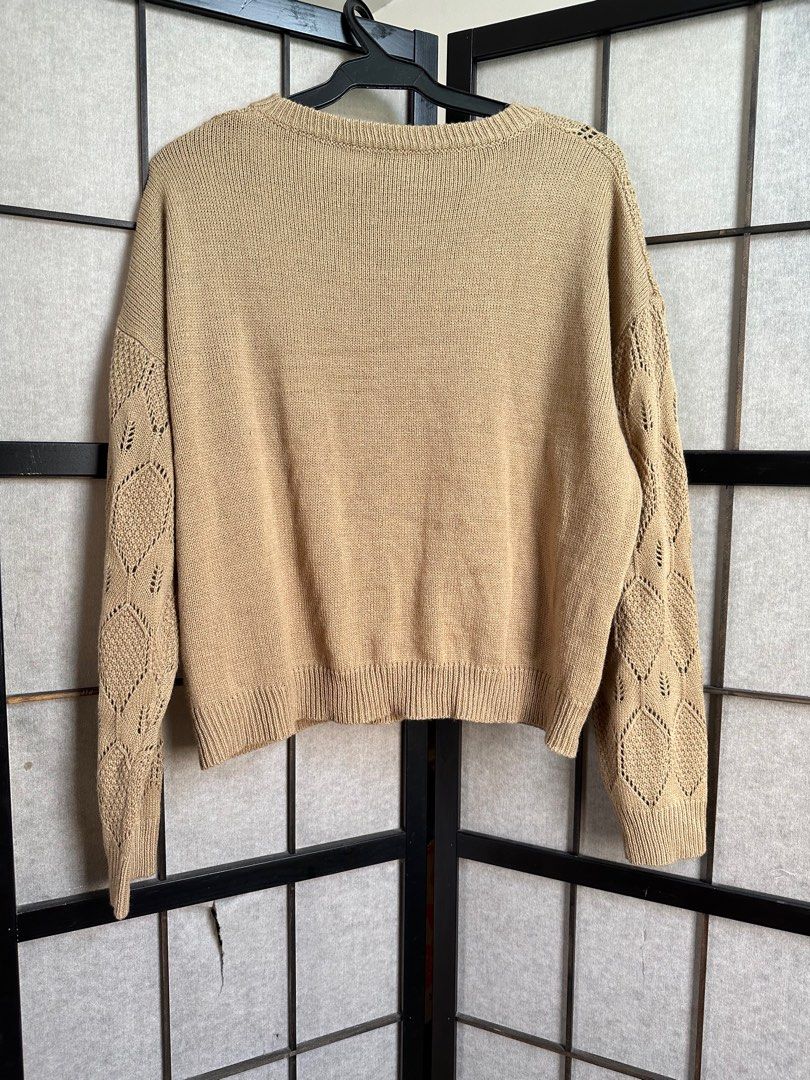 Oversize Beige Knit Sweater (Category: Coats, Jackets and Outerwear) located in Manila. Submitted by echrise (Listing ID 1395954239, Image 3). Description: Small on tag but can fit up to 2xl Worn once Relax Width - 51” - Beige knit sweater - Unique leaf pattern - Round neckline - Long sleeves - Ribbed hem and cuffs - Dress up or down.