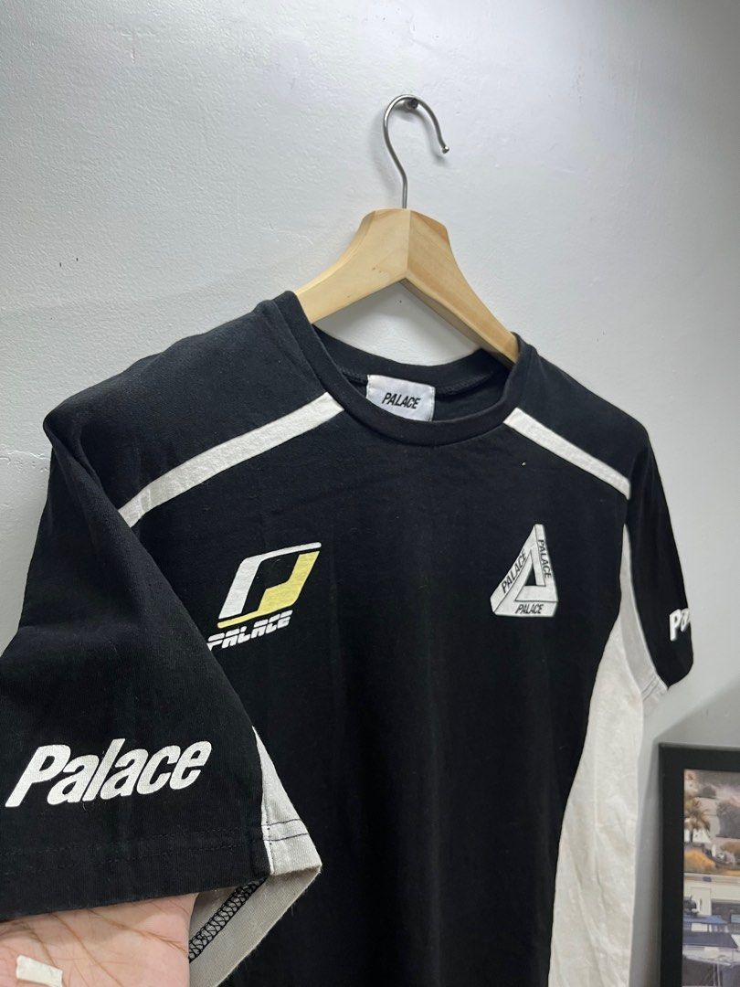 Palace Black and White T-shirt (Category: Tshirts & Polo Shirts ) located in Cavite. Submitted by robievillon (Listing ID 1396093384, Image 3). Description: 22x28” - Palace black and white T-shirt - Features Palace logo on front, back, and sleeves - Crew neck - Short sleeves - Design includes white stripes and panels.
