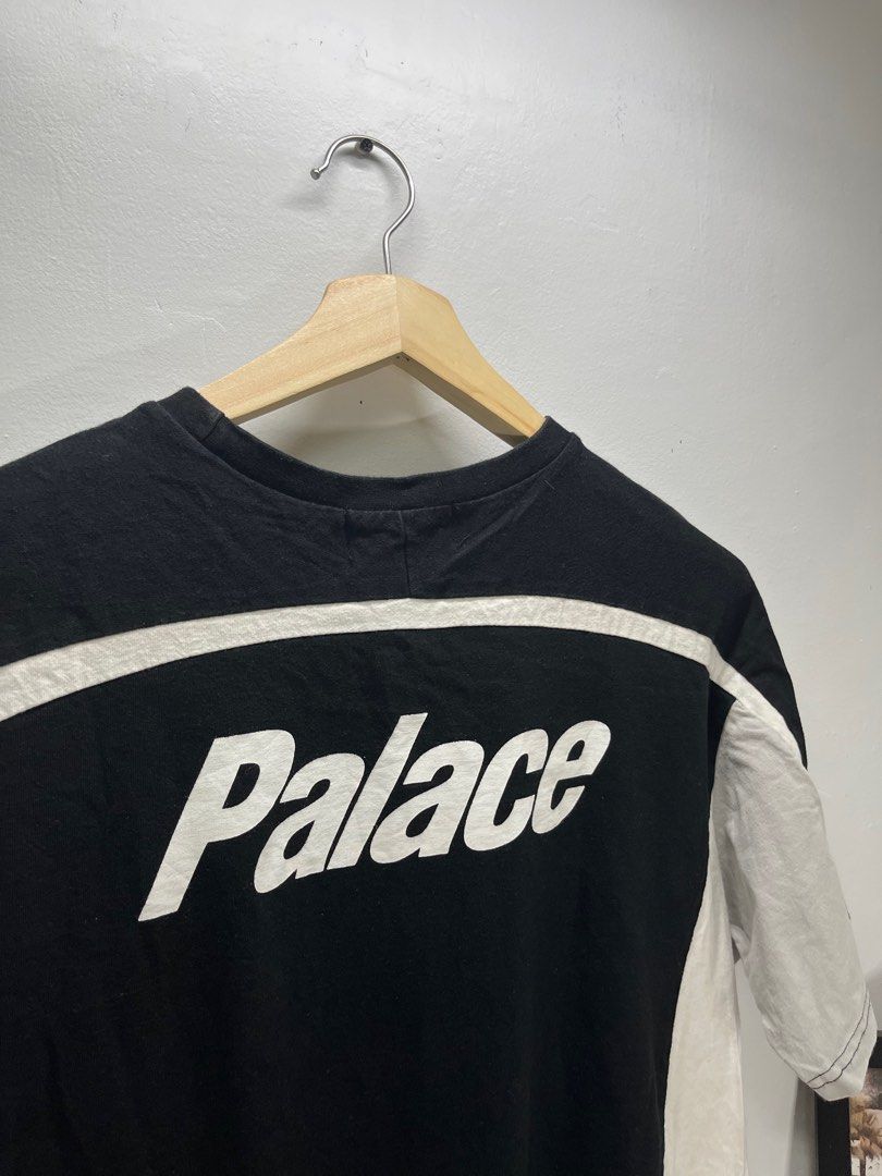 Palace Black and White T-shirt (Category: Tshirts & Polo Shirts ) located in Cavite. Submitted by robievillon (Listing ID 1396093384, Image 1). Description: 22x28” - Palace black and white T-shirt - Features Palace logo on front, back, and sleeves - Crew neck - Short sleeves - Design includes white stripes and panels.