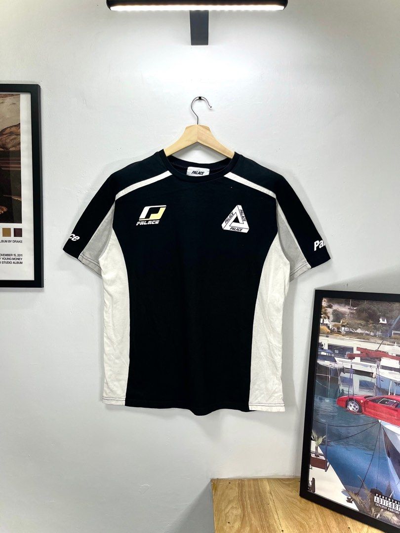 Palace Black and White T-shirt (Category: Tshirts & Polo Shirts ) located in Cavite. Submitted by robievillon (Listing ID 1396093384, Image 2). Description: 22x28” - Palace black and white T-shirt - Features Palace logo on front, back, and sleeves - Crew neck - Short sleeves - Design includes white stripes and panels.