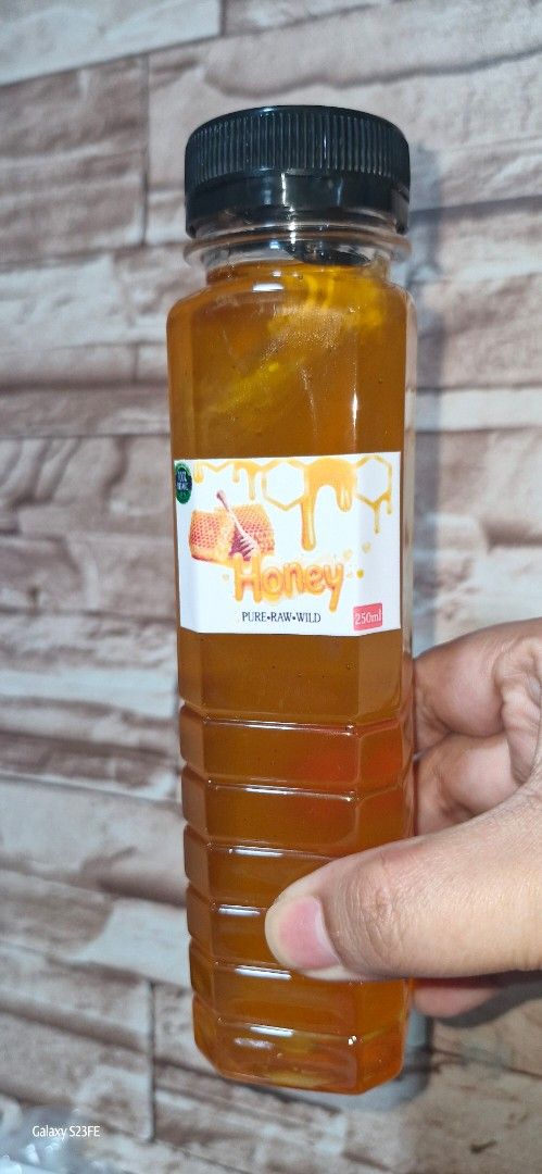 Pure Raw Wild Honey (Category: Other Food & Drinks) located in Mandaluyong City. Submitted by Cel_EB23 (Listing ID 1395983533, Image 2). Description: - 100% Original Honey - No added sugar or preservatives - Perfect for milk and tea - Kid-friendly! - Available in different sizes - Long-lasting.
